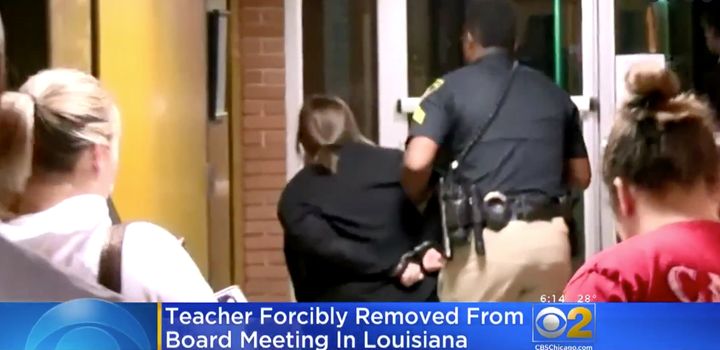 A Louisiana schoolteacher was filmed being forced out of a school board meeting in handcuffs after questioning a superintendent's pay raise. She was reportedly later booked at the local jail.