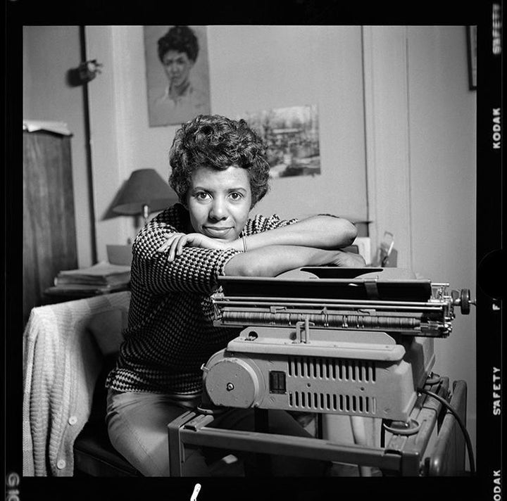 <p> <em>Lorraine Hansberry leans over her typewriter in her Greenwich Village apartment on Bleecker Street during her April 1959 photoshoot for Vogue. Photo by David Attie.</em> </p>