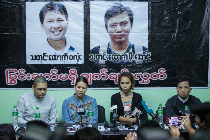 Pan Ei Mon, center left, wife of Reuters journalist Wa Lone, and Nyo Nyo Aye, center right, sister of Reuters reporter Kyaw Soe Oo, talk to journalists during a press briefing in Yangon, Myanmar, on Dec. 28.
