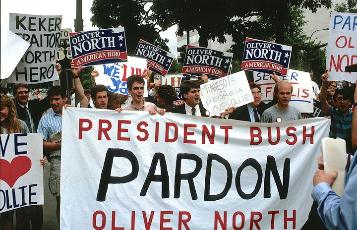 Oliver North became a conservative star after he defiantly admitted to breaking the law in the Iran-Contra scandal. His supporters rallied to his side ahead of his sentencing hearing in 1989.