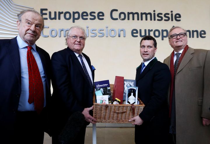 British politicians including member of MEP, Steven Woolfe, Digby Jones, chairman of Labour Leave John Mills, and co-chairman of Leave Means Leave John Longworth pose with an hamper with British products as they arrive for a meeting with European Union's chief Brexit negotiator Michel Barnier.