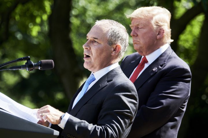 Scott Pruitt, administrator of the Environmental Protection agency stands with U.S. President Donald Trump.