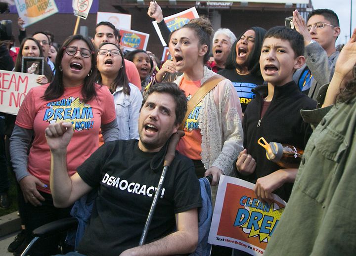 Ady Barkan, center, participates in a protest earlier this month for a "clean" Dream Act outside the Los Angeles office of Sen. Dianne Feinstein (D-Calif.)