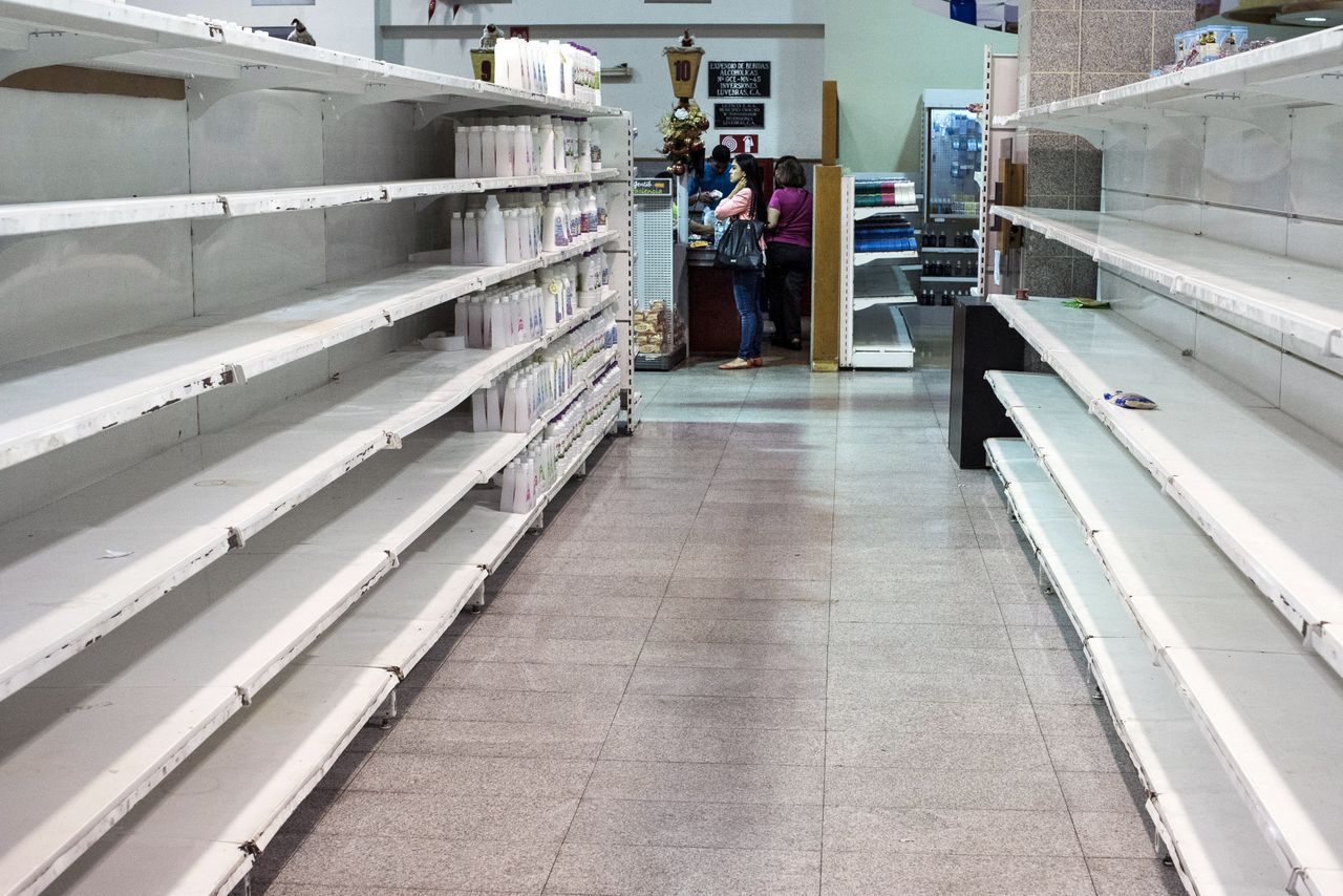 Nearly empty shelves at a store in Caracas, Venezuela.