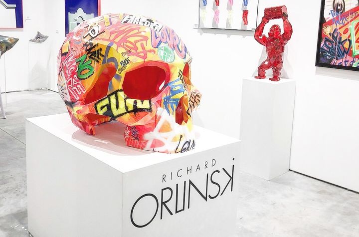 A selection of Orlinski’s work on display at the Context Art Fair in Miami, FL, during Art Basel 2017 in December. Pictured in the center is the large-scale, multicolor sculpture he created for French fashion brand The Kooples. The brand’s signature emblem is a skull, and this one created by Orlinski has already toured multiple cities around the world, including Paris.