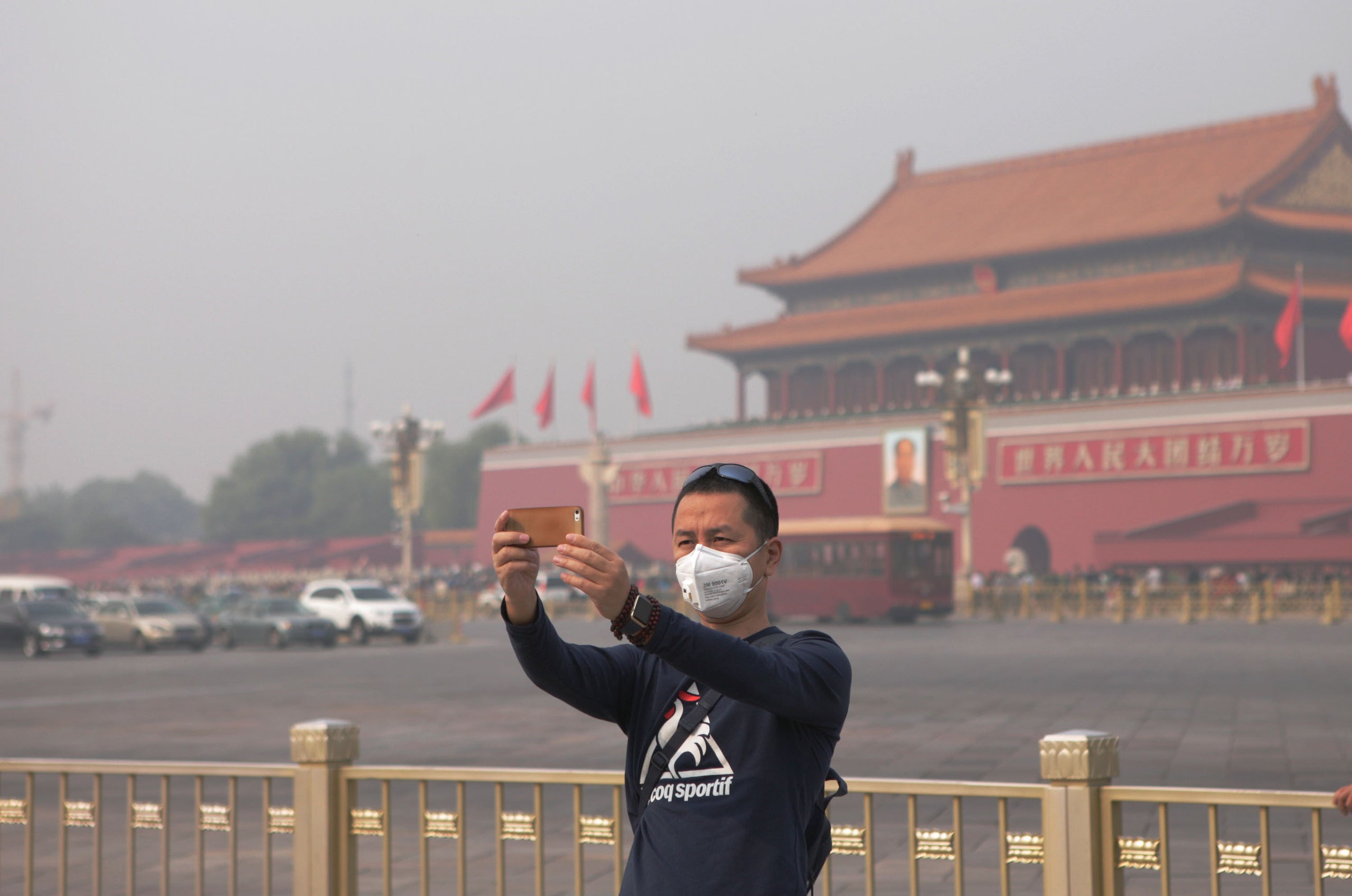 A man wears a face mask while taking a selfie in Beijing in 2015. Ed Avol, a professor of clinical preventive medicine,