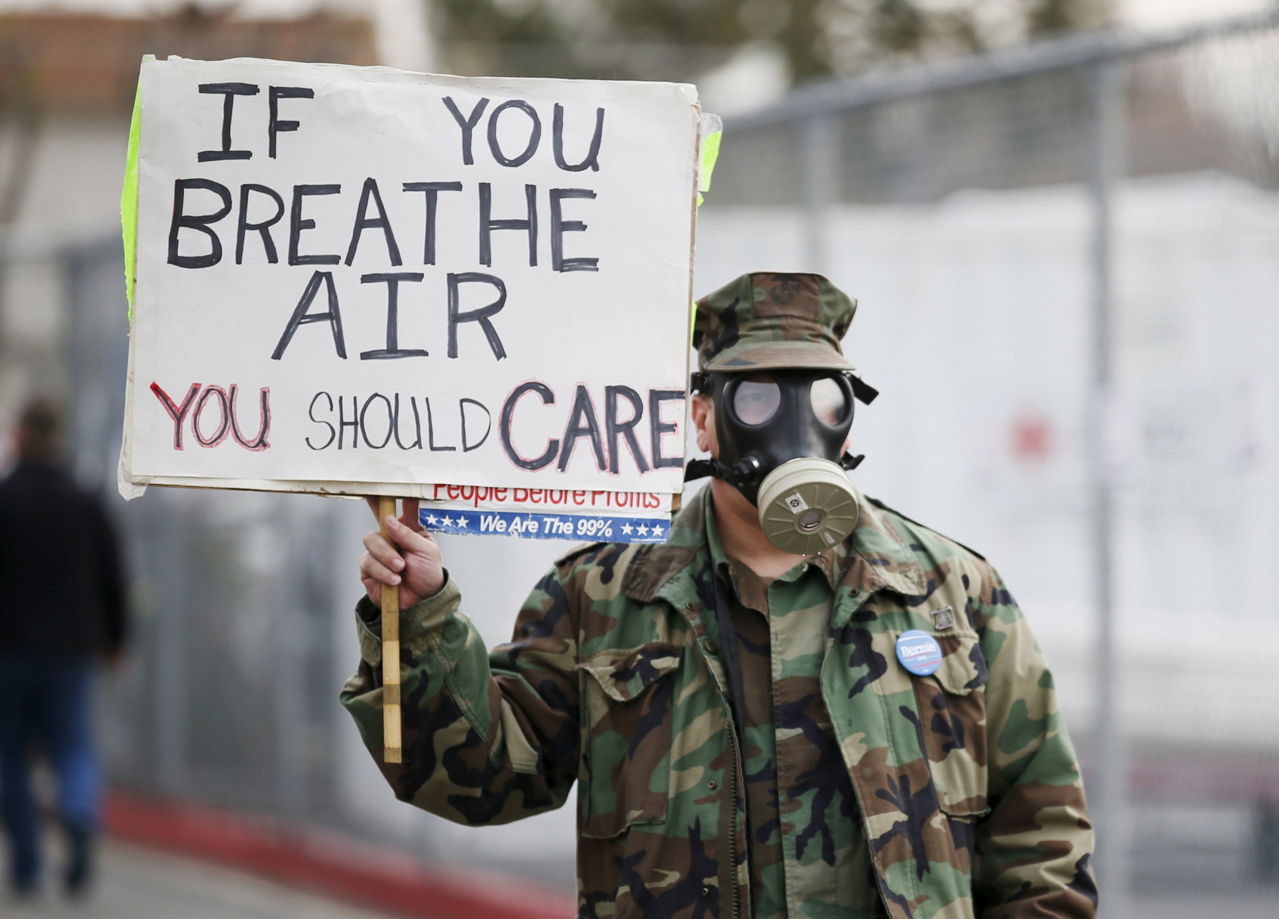 Air quality has dramatically improved in Los Angeles in recent decades. A protester, seen above, picketed in 2016 following a