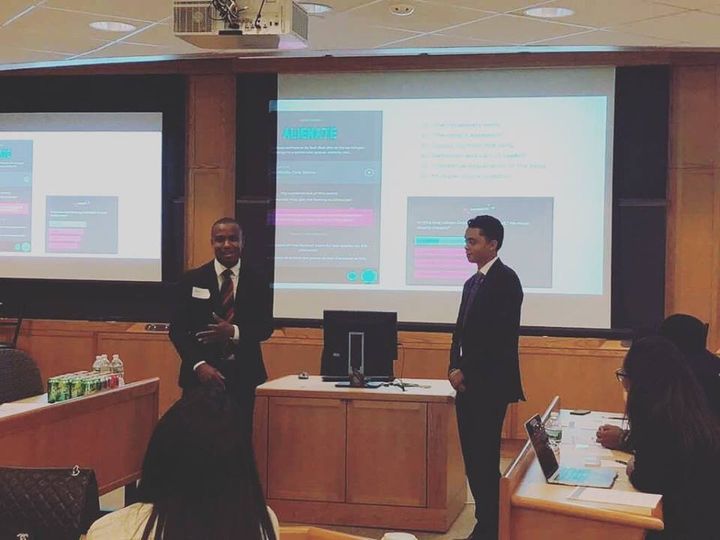 <p>Rhymes with Reason founder Austin Martin (right) co-presenting his organization with Harvard Master’s candidate Jordan Jerome Harrison (left) at the Harvard Graduate School of Education</p>