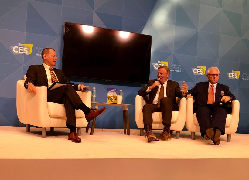 Author John Grisham (middle) and Dr. Neal Kassell (right)