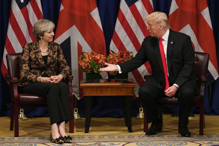 Six months after the hand holding in the White House, May looked more cautious about taking the president's hand when they met in New York in September