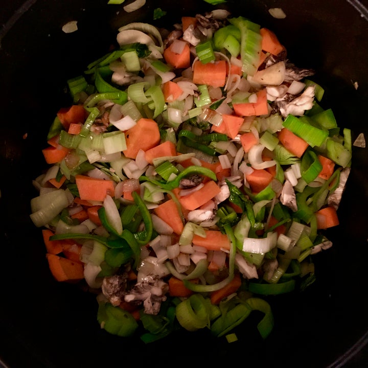 After the meat has been browned, add the aromatic vegetables and mushrooms