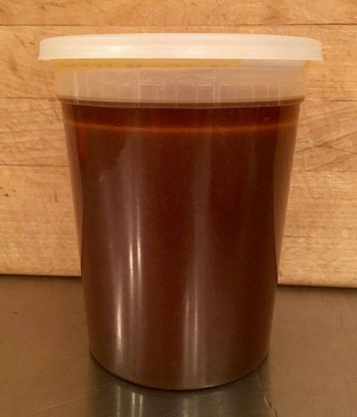 Almost a quart (liter) of sauce; the fat will congeal in the fridge and can then be removed in one piece