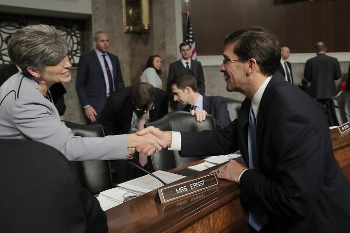 Senate Armed Services Committee member Rep. Joni Ernst (R-IA) (L) greets Mark Esper before his confirmation hearing to be secretary of the U.S. Army in the Dirksen Senate Office Building on Capitol Hill November 2, 2017 in Washington, DC. Nominated by President Donald Trump, Esper is an Army veteran and currently serves as vice president of government relations for the giant defense contractor Raytheon.