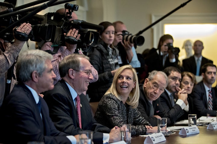 Secretary of Homeland Security Kirstjen Nielsen, center, and Rep. Bob Goodlatte (R-Va.), second left, smile during
