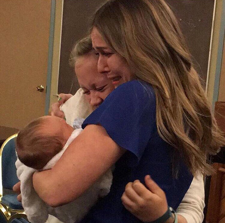 Hannah Mongie as she gave her baby Taggart to his adoptive mum, Emily Marsh. 