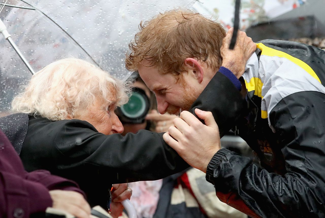 Jackson calls Prince Harry 'a hugger'. Here, the photographer captures the Royal hugging Daphe Dunne, 97, ahead of an Invictus Games launch event in Sydney.