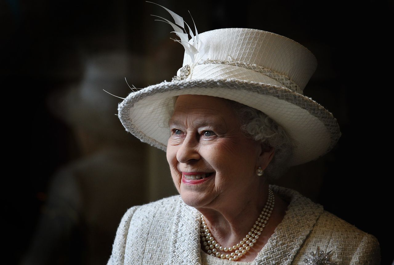 'Sometimes... The light just drops through the window... you get an image you're really happy with'. The queen smiles as she visits Cyfarthfa High School and Castle in Merthyr, Wales.