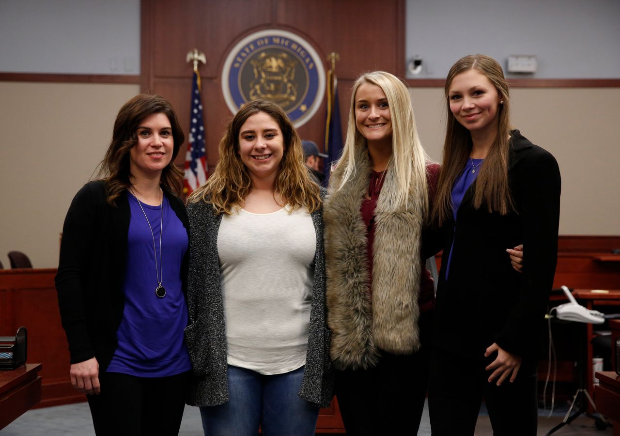 Nassar survivors Larissa Boyce, Alexis Alvarado, Christine Harrison and Jessica Smith (left to right) pose for a picture in court after the Nov. 22, 2017, hearing in which Nassar pleaded guilty to criminal sexual conduct.