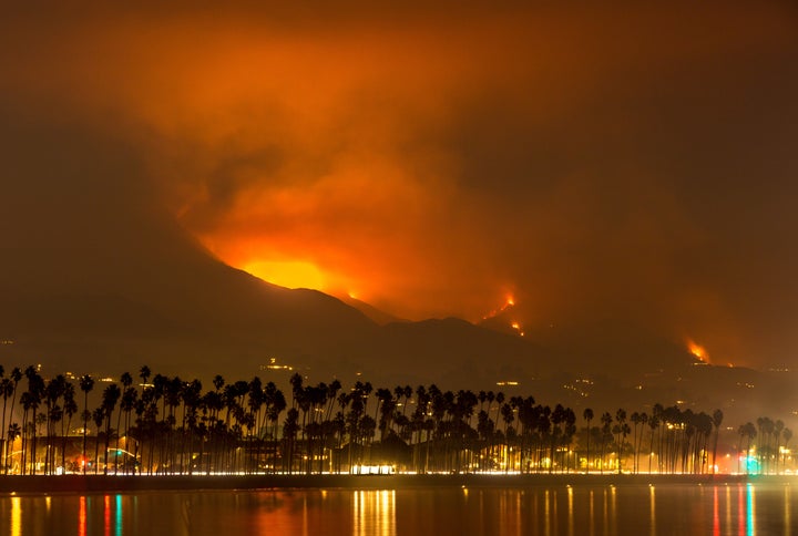 Fire, smoke and ash from the Thomas Fire is visible in the hills above Montecito, California, on Dec. 13.