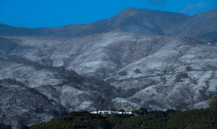 A house remains standing in front of an ash-filled hillside in Montecito, California, on Dec. 20.