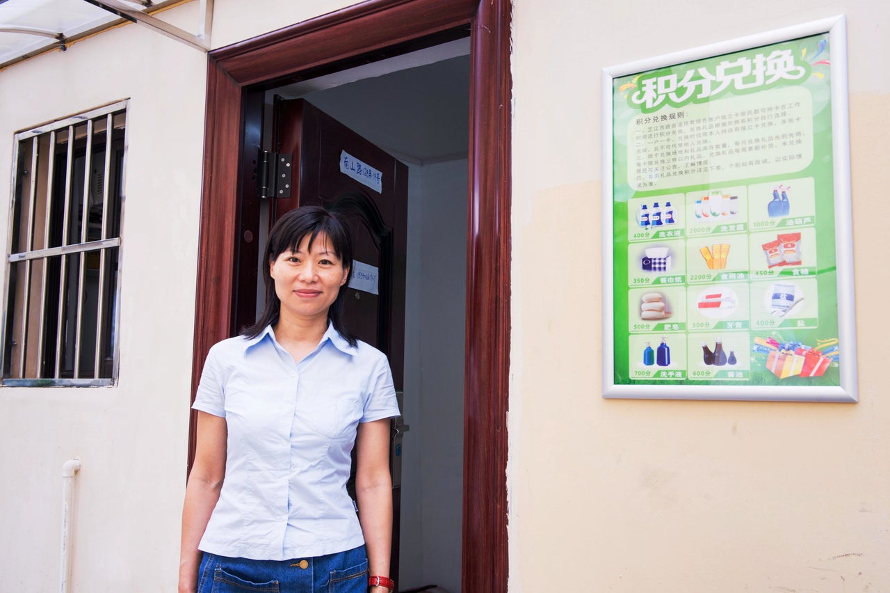 Zhang Qin is an employee of a new neighborhood recycling center in Shanghai. She spends her days in a small windowless office where she exchanges residents' recyclable materials for "prizes," such as shampoo, toothpaste and toilet paper.