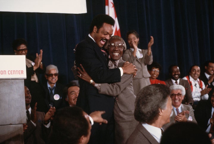 The Rev. Jesse Jackson hugs former New York congresswoman and presidential candidate Shirley Chisholm in 1983 after announcing his candidacy for the U.S. presidency.