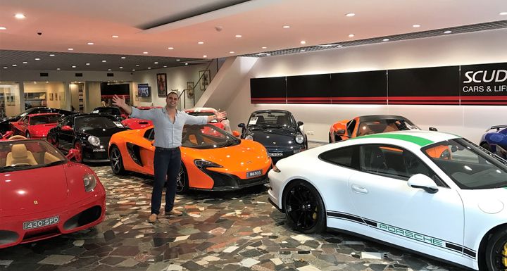 Lecha Khouri standing beside some of the many cars available to purchase from Scuderia Graziani.
