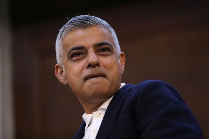 Sadiq Khan looks on during the disruption