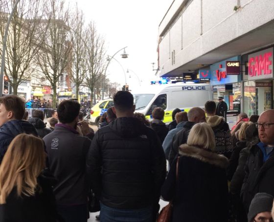 A man has been arrested on suspicion of murder following an attack on a woman at a TUI store in Southport, Merseyside.