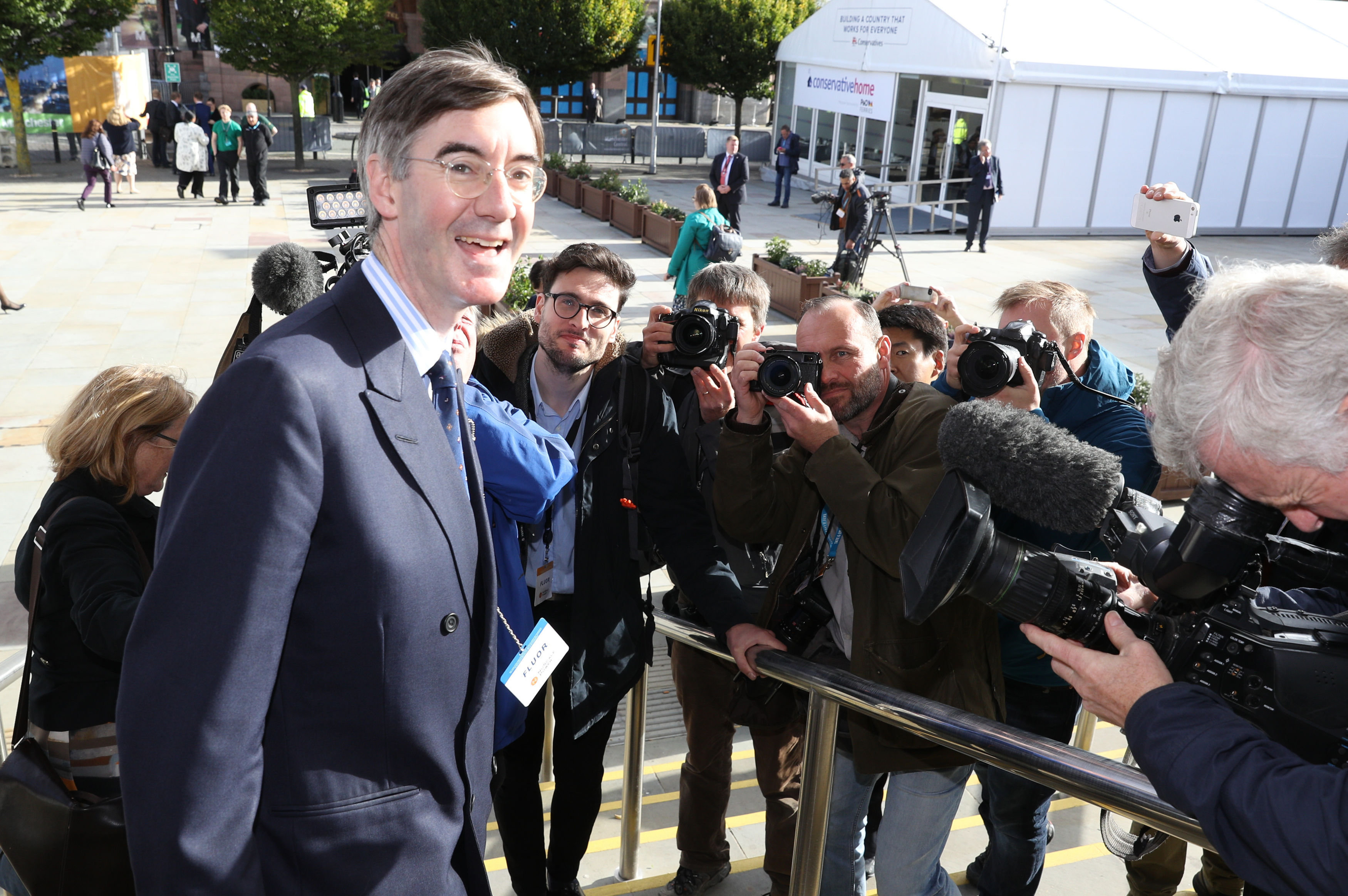 Jacob Rees-Mogg snapped by photographers on his way into the Tory conference in October. 