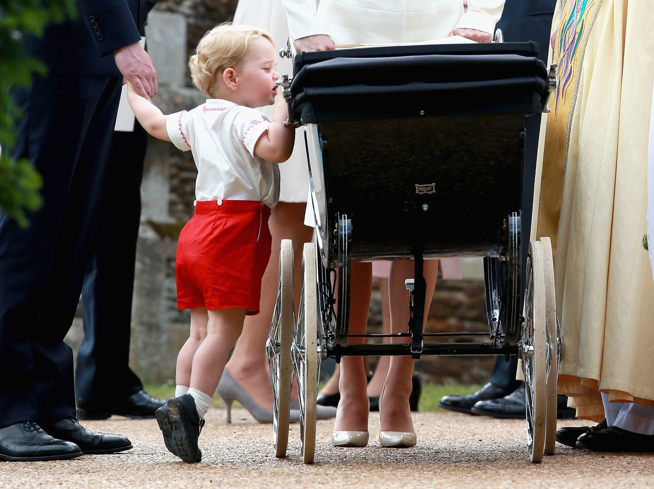 Prince George looks in Princess Charlotte's pram at her christening. Jackson: 'I just capture these sweet moments'.