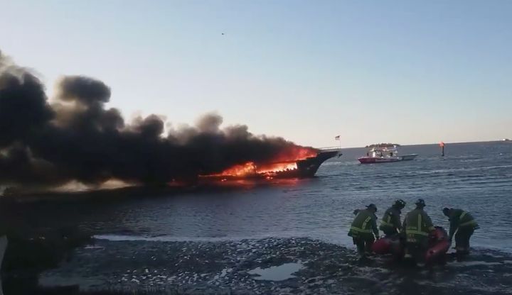 Firefighters on the scene of the casino boat fire.