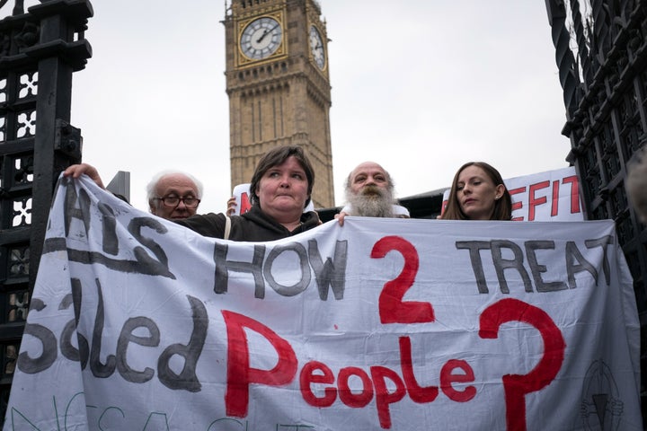 Disability cuts campaigners outside Parliament