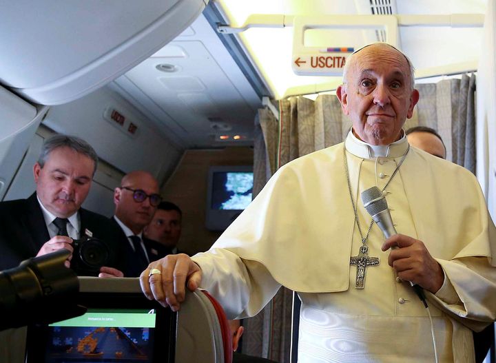 Pope Francis speaks to reporters onboard the plane for his trip to Chile and Peru, January 15, 2018. (REUTERS/Alessandro Bianchi)