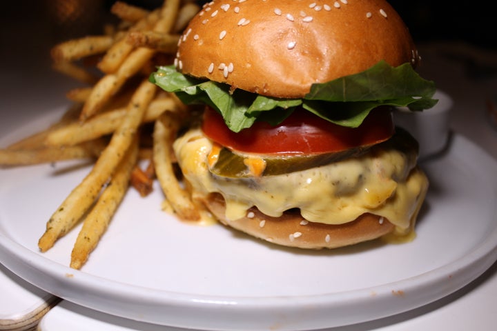 Quarter Pounder Cheeseburger with charred spring onion compote, Kochujang mayonnaise, served with french fries.