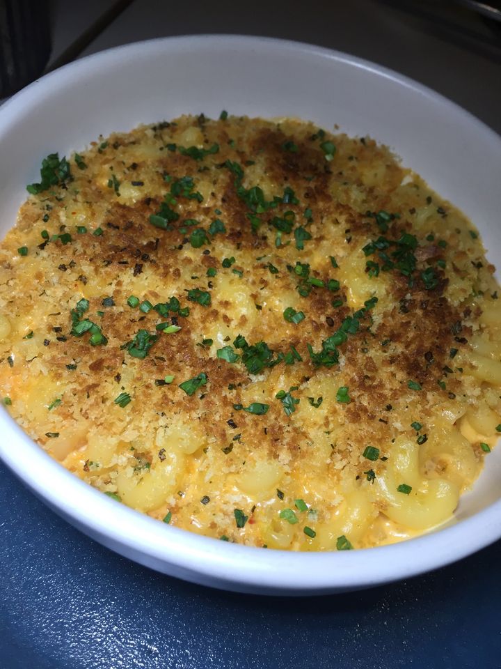 Kimchee Mac and Cheese prepared with aged cheddar and beer.