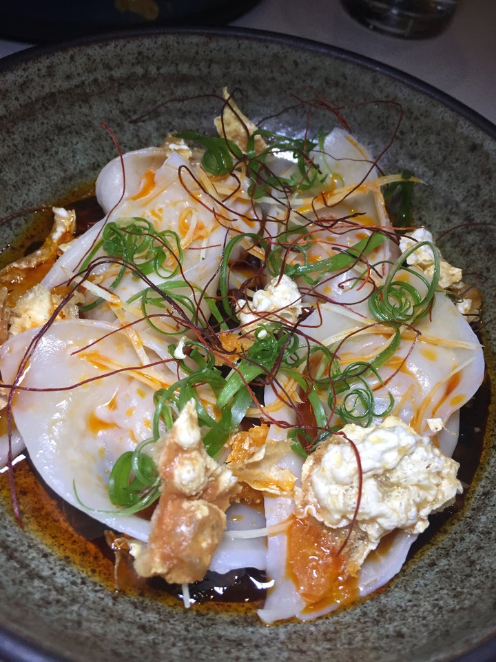 <p>Chicken and Black Soy Stuffed Wontons with garlic and chili butter.</p>