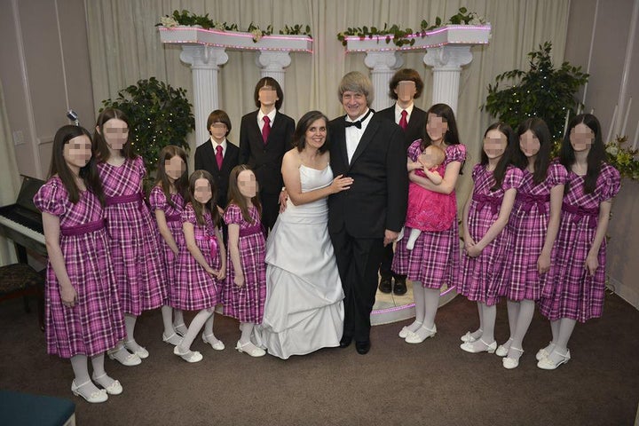 The Turpins pose with their 13 children, whom authorities said were extremely malnourished and physically abused.