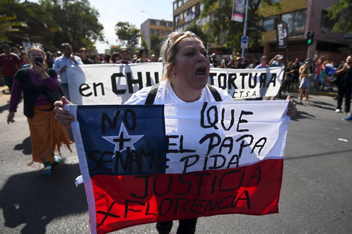 People demonstrate against the visit of Pope Francis to Chile.