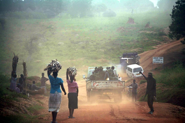 Ugandans internally displaced by fighting in November 2005 fetch water and firewood near Kitgum in the north of the coun