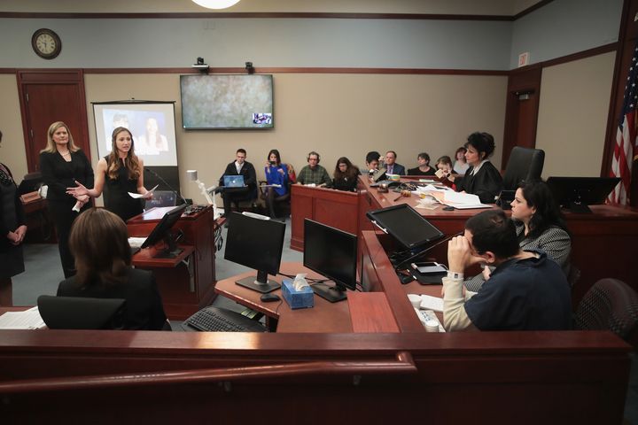 Larry Nassar (bottom right) listens to victim impact statements in court on Tuesday, Jan. 16.