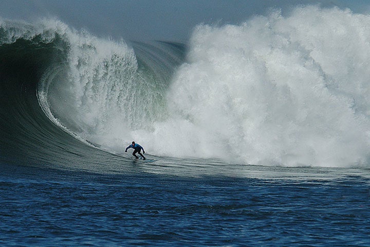 <p>Grant Washburn with the bottom turn at Maverick’s.</p>