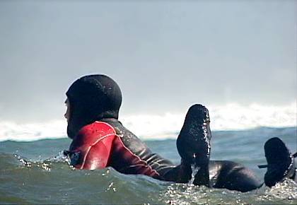 Kelly Slater paddling out at Maverick’s.