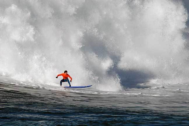 Greg Long trying to beat the whitewash at Maverick’s.