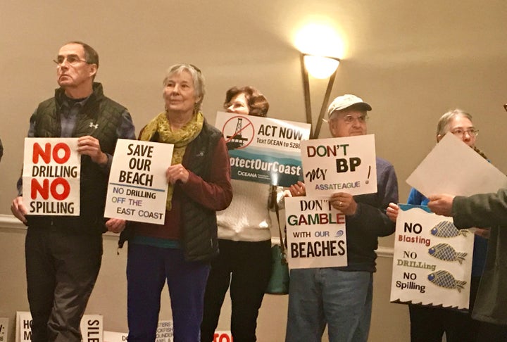 Jeff Evans and Paula Deschamp (far left) and others in Annapolis protest the Trump administration's plan to expand offshore drilling on Jan. 16.