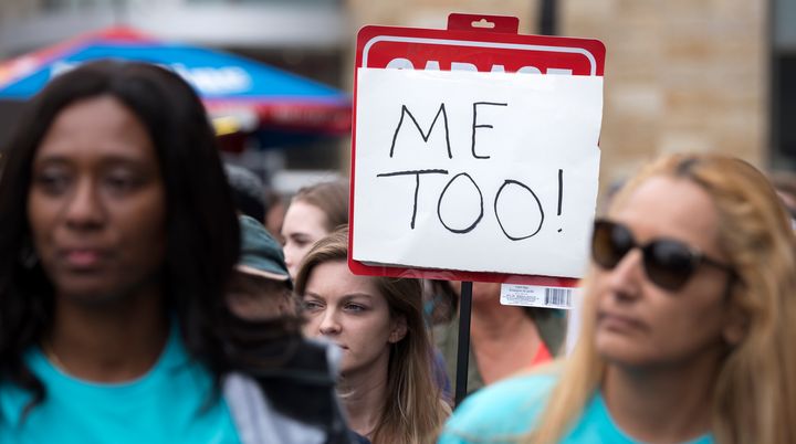 Protesters attend a Me Too rally in Los Angeles, California on November 12, 2017. 