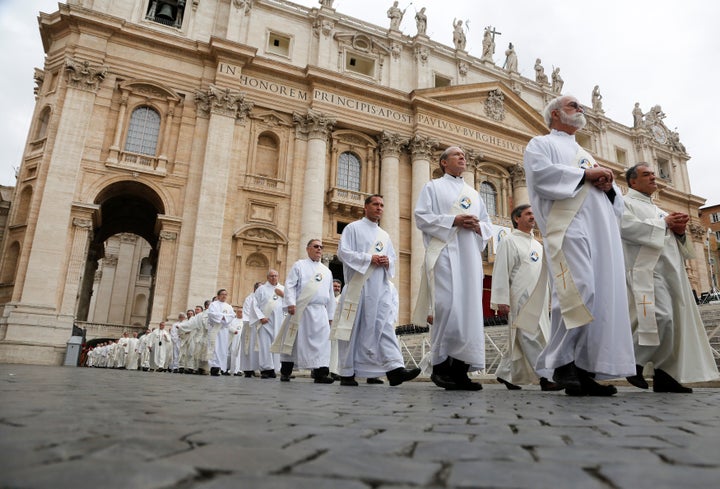 Deacons walk into St. Peter's Square on May 29, 2016, before Pope Francis leads a mass for the Jubilee for Deacons.