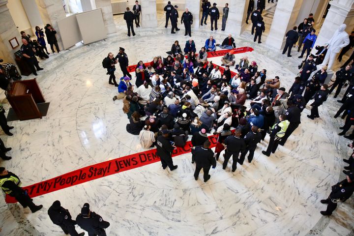 Protesters continued to sing and chant as they were arrested by Capitol Police.