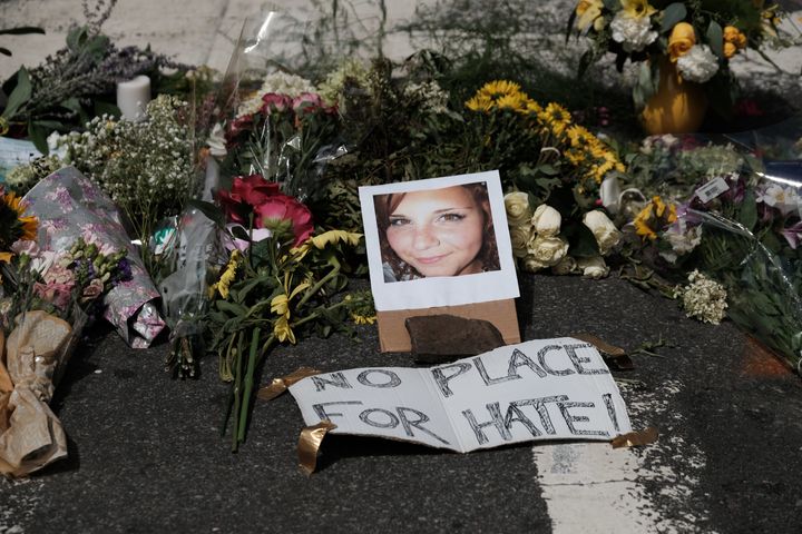 Flowers and a photo of car-ramming victim Heather Heyer lie at a makeshift memorial in Charlottesville, Virginia. 