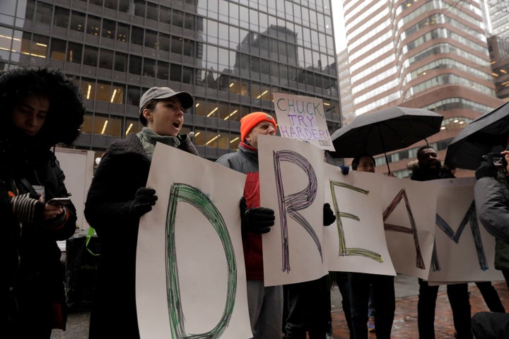 Activists outside the New York office of Sen. Chuck Schumer (D-N.Y.) on Wednesday ask that protections under the Deferred Action for Childhood Arrivals program be spared.